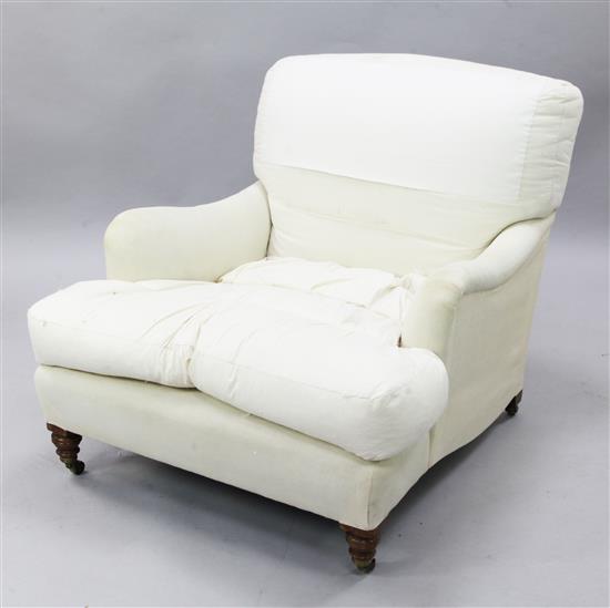 A Victorian Howard & Sons club armchair, H.2ft 8in. L.3ft 8in.